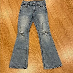 S-O-L-D. 
No Boundaries Flare Jeans with distressing. Juniors size 9.